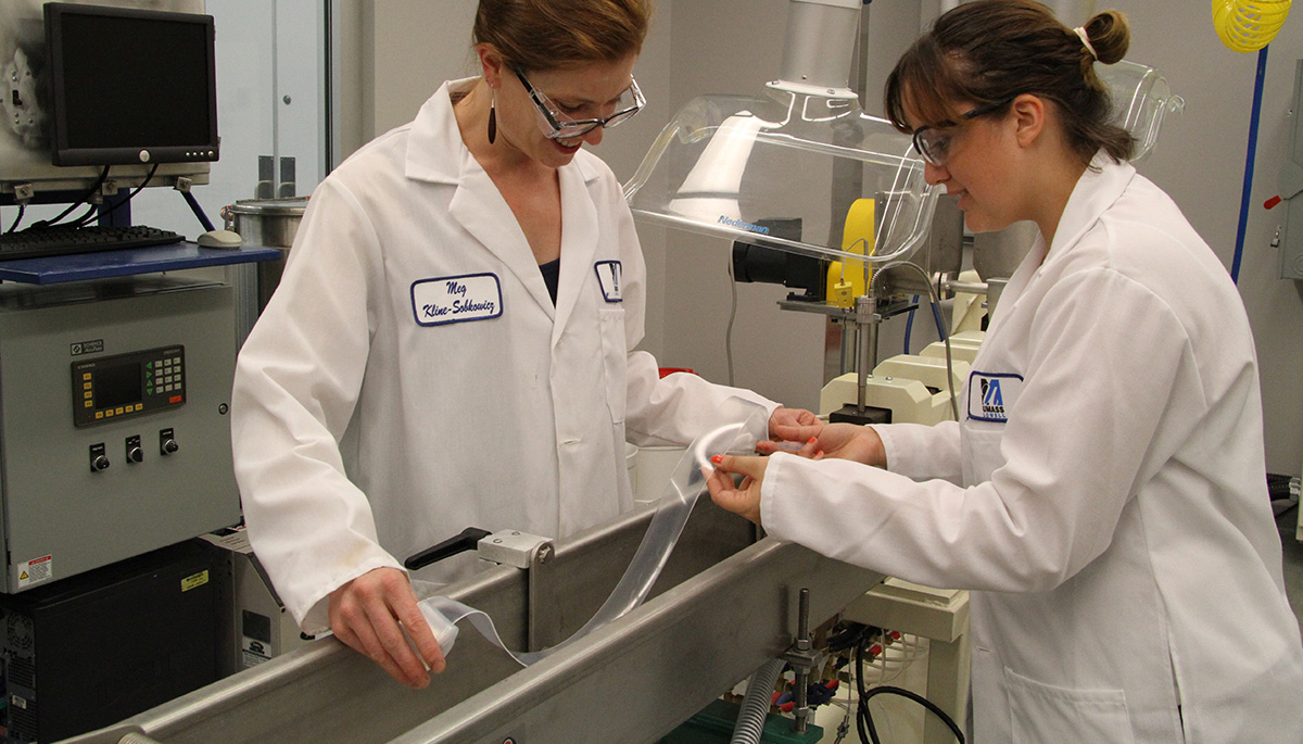 UMass Lowell medical plastics design and manufacturing students in a lab