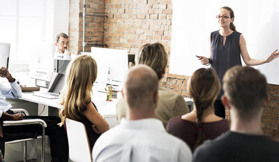 A teacher training a corporate workforce.