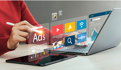 A digital marketer using various marketing software.