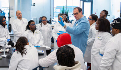 Students engaged in bioversity class with professor
