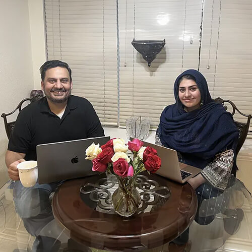 MBA student Atta Meer and his daughter, business major Khadija Mir, spent many hours last summer doing their coursework together at the family dinner table in Allen, Texas.