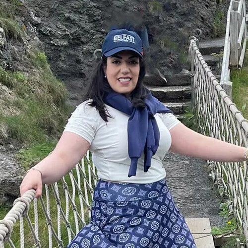 Parisa Raad stands on the Carrick-a-Rede Rope Bridge in Northern Ireland as part of a study abroad trip. 